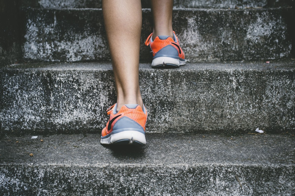 Person climbing outdoor stairs